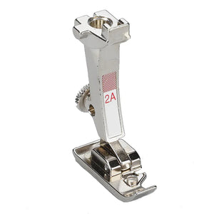 Metal sewing machine foot on a white background Metal sewing machine foot on a white background