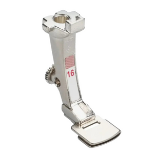 Metal sewing machine foot with a red label on a white background Metal sewing machine foot with a red label on a white background