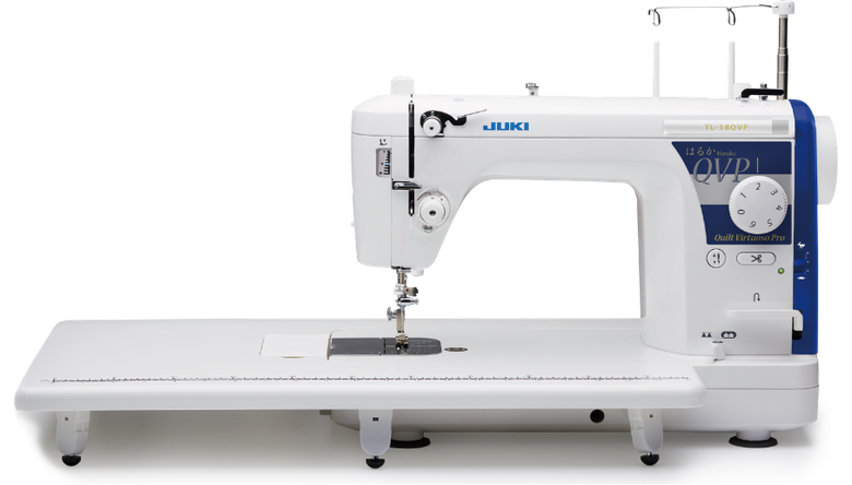 Juki Quilting tl-18 qvp sewing machine with a long white quilting table base, white body, and blue accents on the control panel. Juki Quilting tl-18 qvp sewing machine with a long white quilting table base, white body, and blue accents on the control panel.