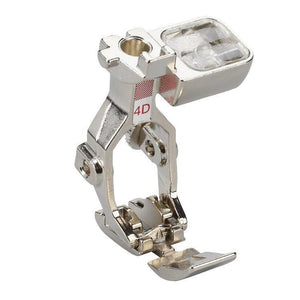 Metal sewing machine presser foot on a white background Metal sewing machine presser foot on a white background