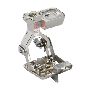Metal sewing machine foot on a white background