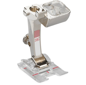 Sewing machine presser foot on a white background