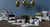Decorative setup with sewing machines, balloons, and small tables against a blue wall.