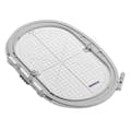 Embroidery hoop with grid pattern on a white background