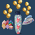 Colorful iron with floral design and gold balloons on a dark blue background